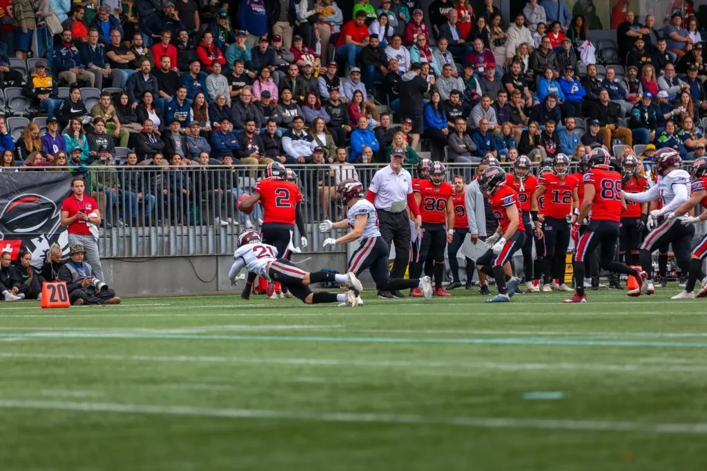 Football player #21 tackling player #2 during a football game.