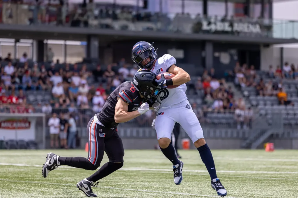 American football player tackled during a fast-paced outdoor game.