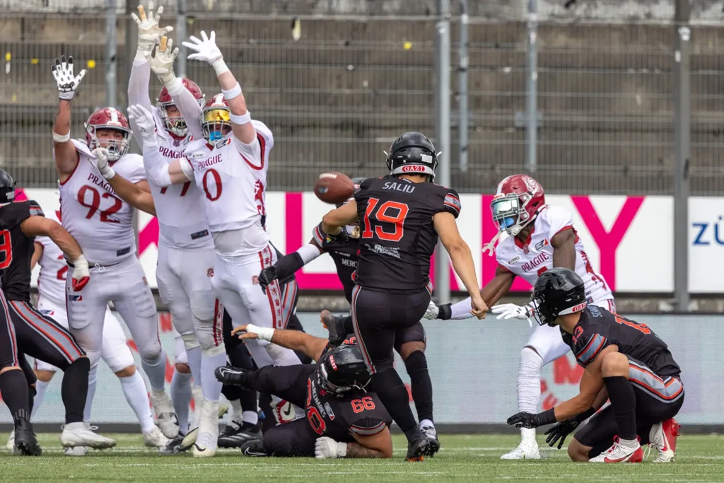 American football players in action during a game, intense play, dynamic motion.